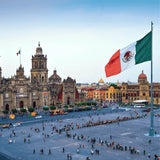 Historic Mexico City plaza with cathedral, large Mexican flag, and crowds, ideal for Canadian vape store content